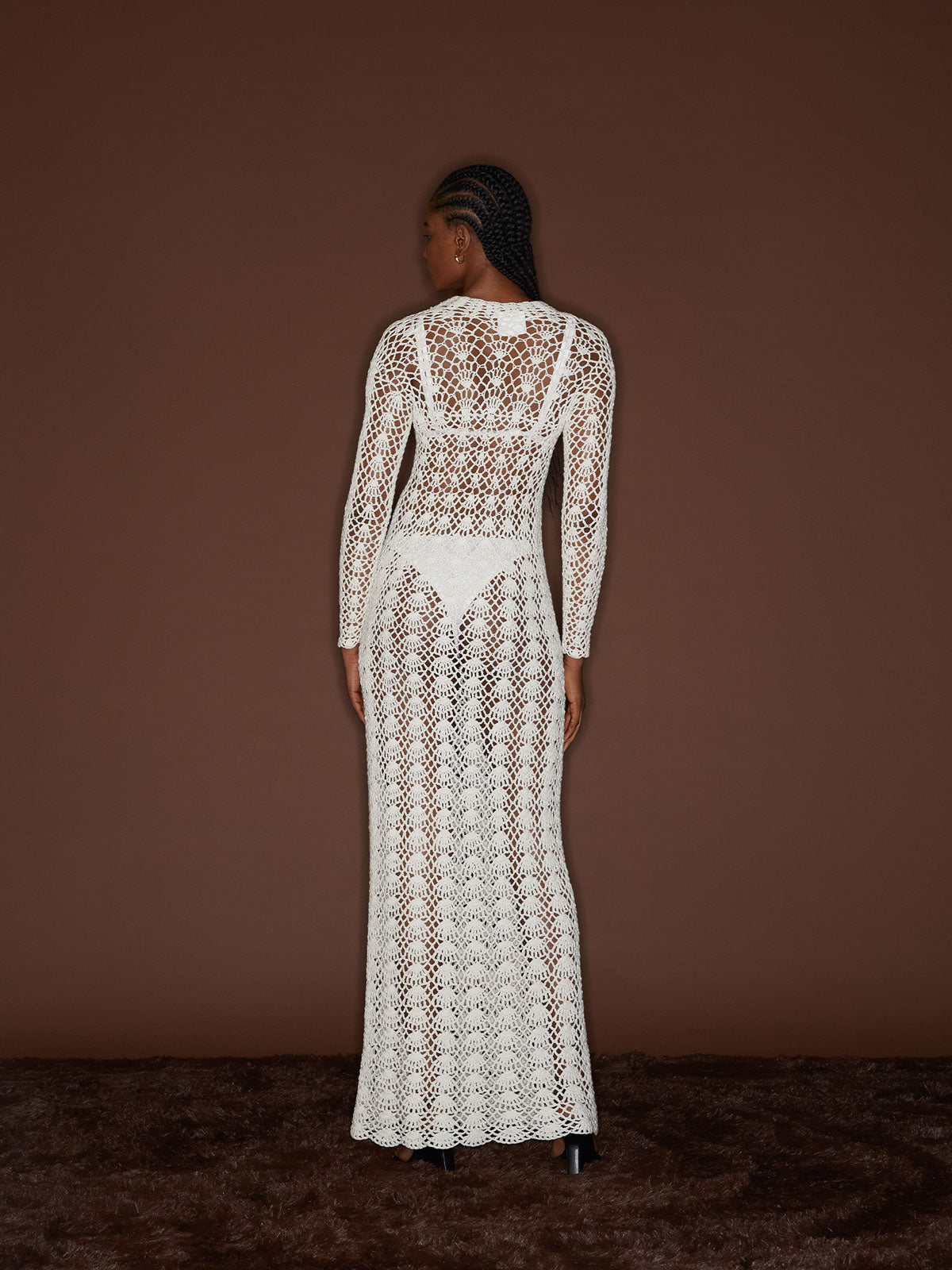 Back view of a female figure wearing the White 09 Crochet Dress