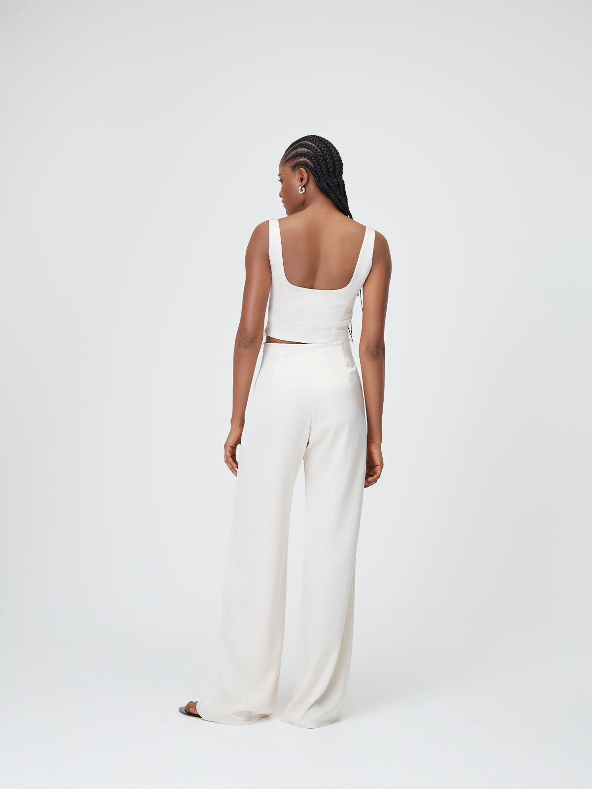 Back view of a model wearing a Ivory Marnie Top and trousers