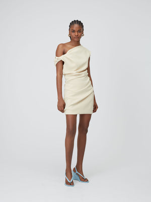 Front view of a model wearing the Butter 09 Remmy Mini Dress on top of a mid grey background