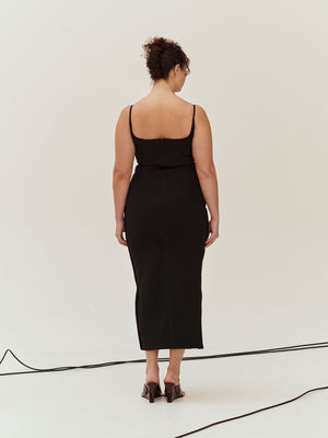 Rear view of a model wearing Black Marlo Dress