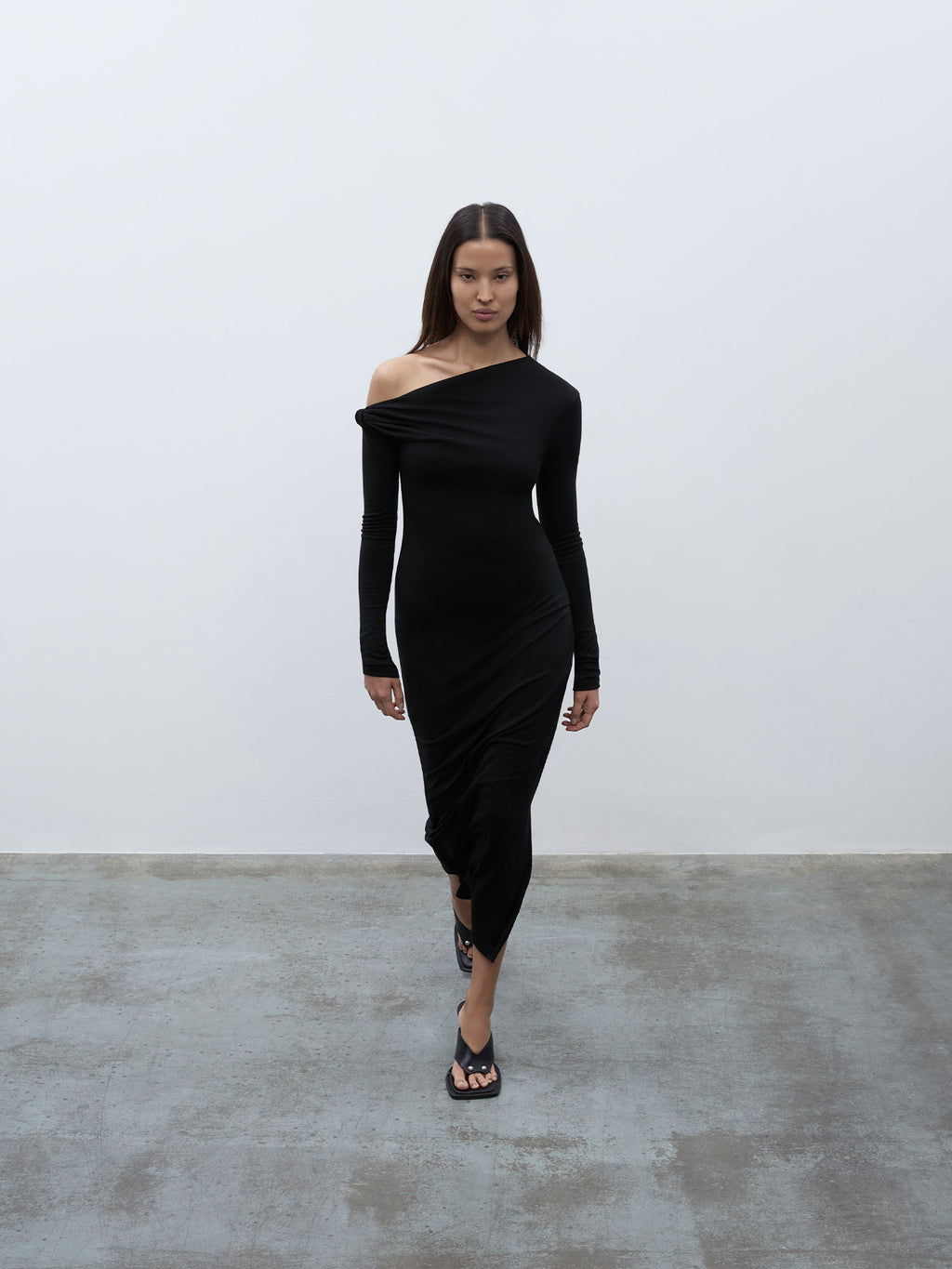 Front view of a model wearing the 05 Elemental Manahou Dress in black