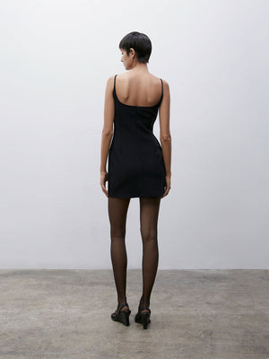 Back view of a model wearing a Black 09 Marlo Mini Dress