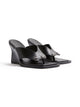 Side view of a pair of Black Dune Wedge high heels
