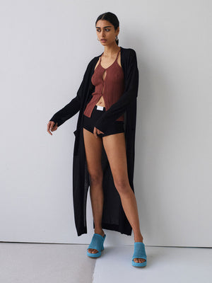Model wearing Elemental Cardi throw in black