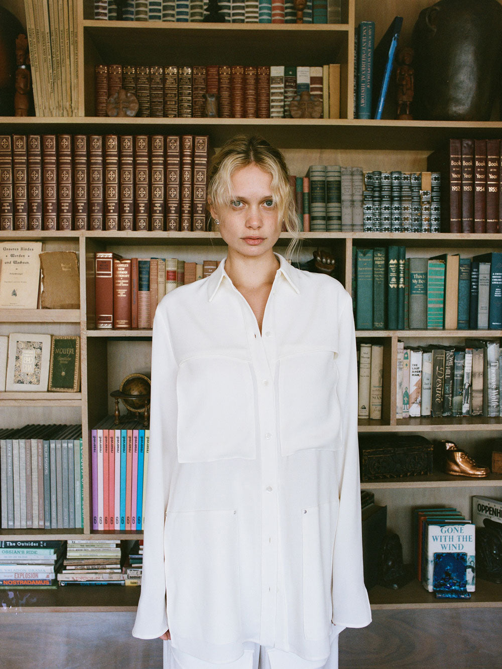 A woman wearing the Ivory Herb Shirt from Paris Georgia